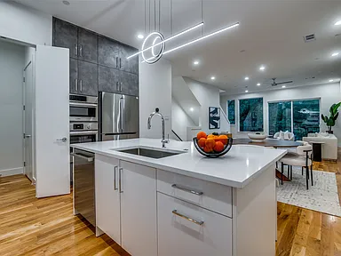 Full home renovation in Addison TX with open plan kitchen and living room modern design by UHS Remodeling