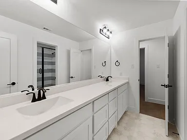 Double vanity bathroom remodel in Allen TX with modern fixtures by UHS Remodeling