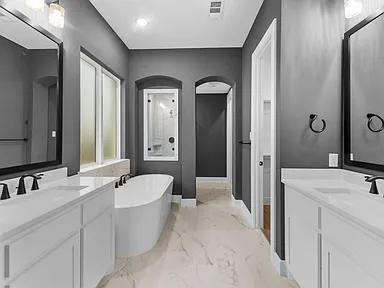 Spa bathroom remodel in Allen TX with freestanding tub and dark accent walls