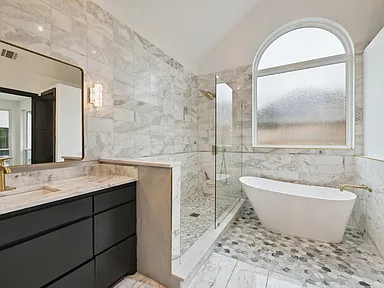 Freestanding soaking tub in bathroom remodel near McKinney TX by UHS Remodeling