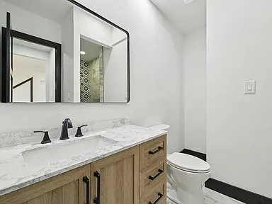 Guest bathroom remodel with modern vanity near McKinney TX by UHS Remodeling