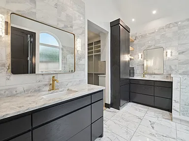 Bathroom remodel in McKinney TX with marble vanity and modern fixtures by UHS Remodeling