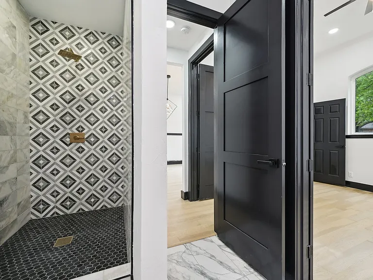Walk-in shower with patterned tile in bathroom remodel near McKinney TX by UHS Remodeling