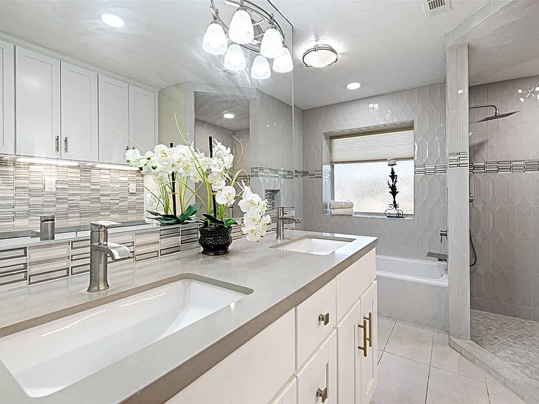 Master bathroom remodel in Carrollton TX double vanity mosaic accent tile by UHS Remodeling