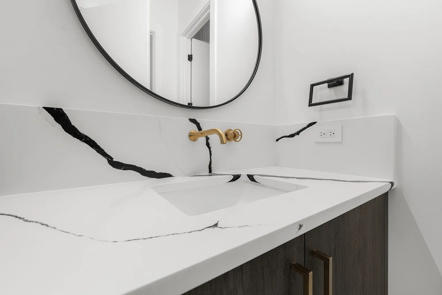 Powder vanity with Calacatta gold marble and brass faucet in full home remodel Dallas TX by UHS Remodeling