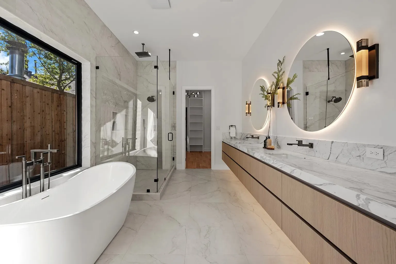 Full view luxury master bathroom with soaking tub and walk-in shower in full home remodel Dallas TX