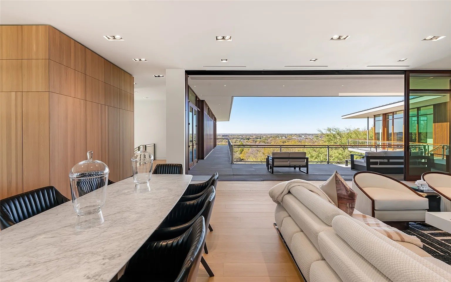 Open plan dining room with terrace and Dallas skyline view in luxury kitchen remodel Dallas TX by UHS Remodeling