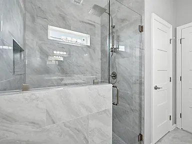 Farmers Branch walk-in shower with marble tile in full renovation