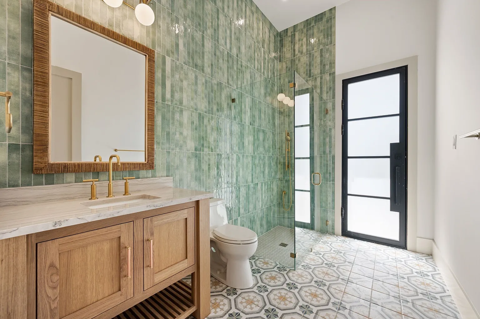 Powder bathroom with green zellige tile and custom wood vanity in full home renovation Frisco TX by UHS Remodeling