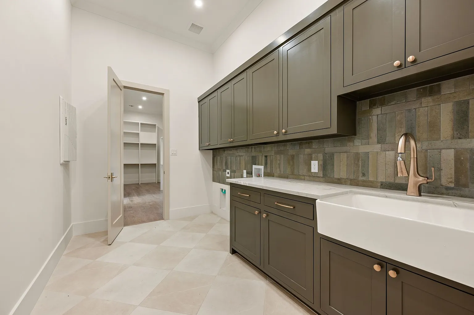 Scullery prep kitchen with farmhouse sink and dark green cabinets in full home renovation Frisco TX by UHS Remodeling