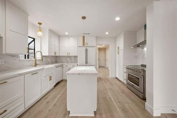 White shaker kitchen with marble counters Dallas TX
