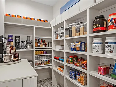 Custom walk-in pantry with built-in shelving and organization in Highland Park TX