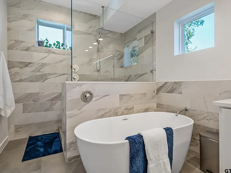 Master bathroom remodel in Highland Park TX with freestanding tub and marble walk-in shower