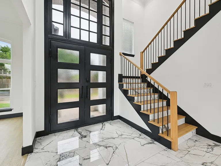 Expanded home entryway in Frisco TX area showing seamless addition by UHS Remodeling