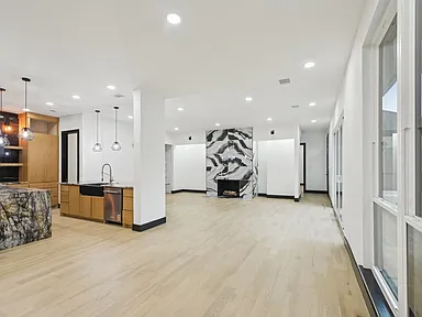 Home addition in Frisco TX with expanded open-concept living space by UHS Remodeling