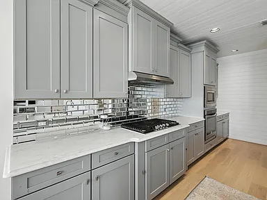 Little Elm TX kitchen with wall cabinets double oven and range hood by UHS Remodeling