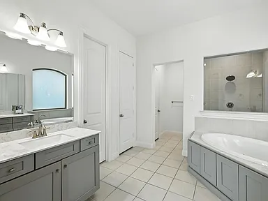 Master bathroom with double vanity and glass shower in Little Elm TX