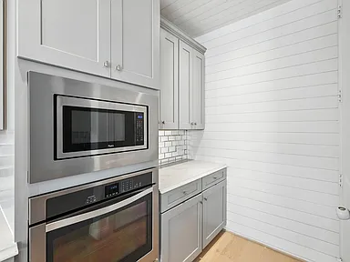 Kitchen appliance nook with microwave and wall oven in Little Elm TX