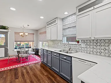 Kitchen alternate angle with dining nook and chandelier in Rowlett TX by UHS Remodeling