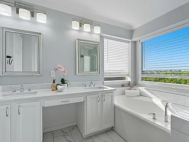 Master bathroom with double vanity and soaking tub in Sachse TX home remodel by UHS Remodeling