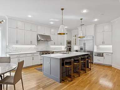 University Park TX kitchen remodel alternate angle white cabinets marble backsplash by UHS Remodeling