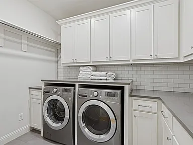 Laundry room remodel white cabinets side-by-side units University Park TX