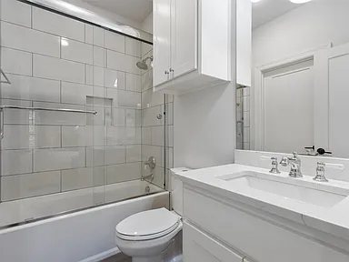 Hall bath tub shower combo white tile University Park TX