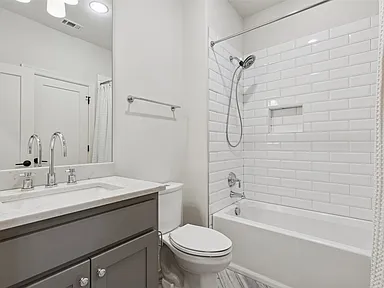 Guest bath dark vanity subway tile University Park TX