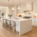 Luxury Plano TX kitchen remodel with white shaker cabinets and marble waterfall island by UHS Remodeling
