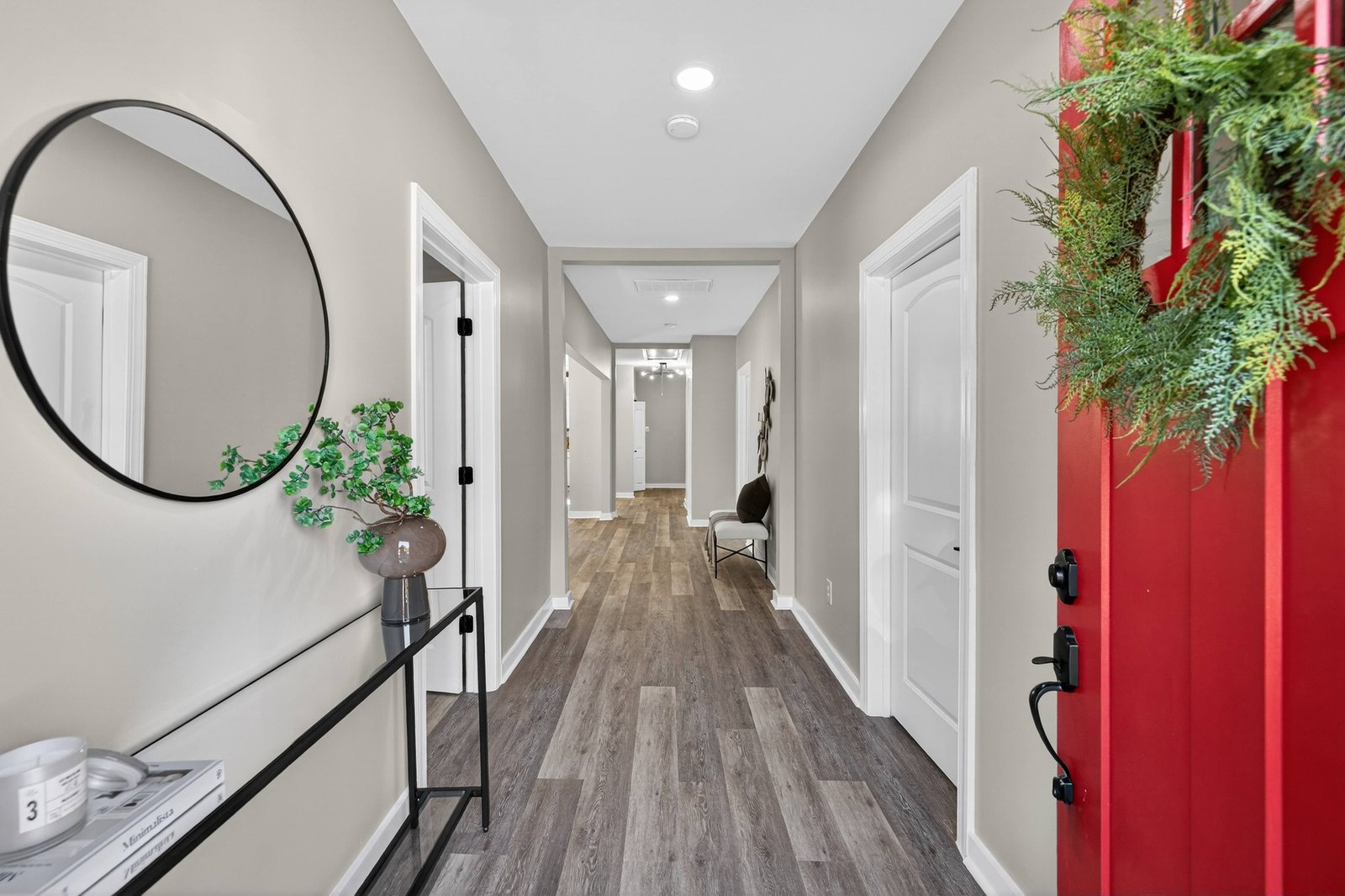 Entryway and hallway of a renovated Dallas–Fort Worth home by UHS Remodeling