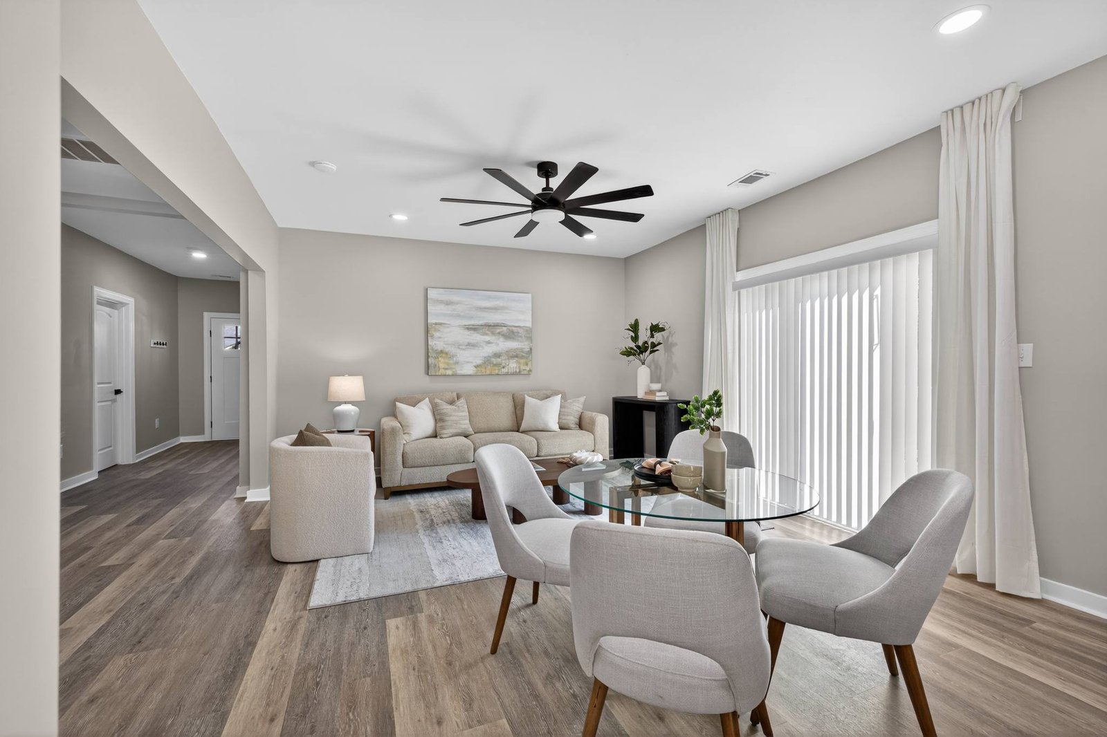 Open-concept living and dining room in a Frisco, TX interior remodel by UHS Remodeling