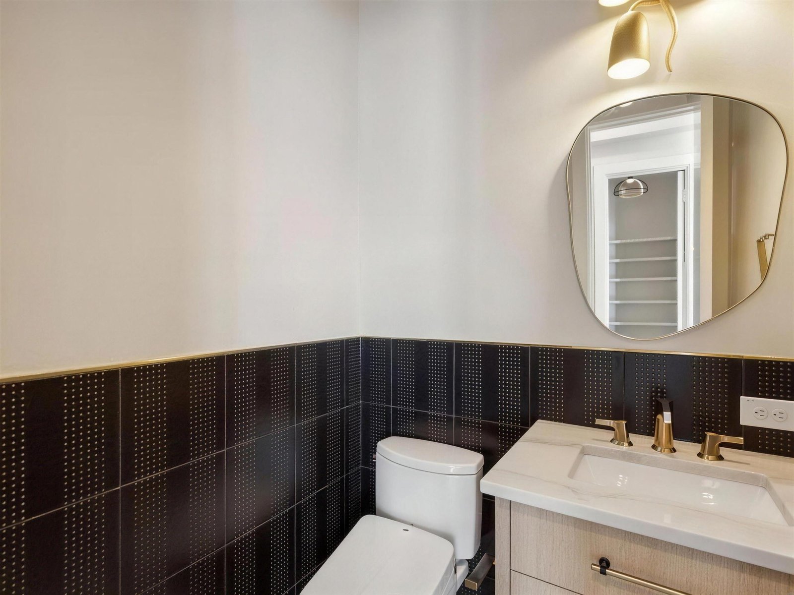 Bathroom remodel in The Colony, TX — black gold powder bath — UHS Remodeling project