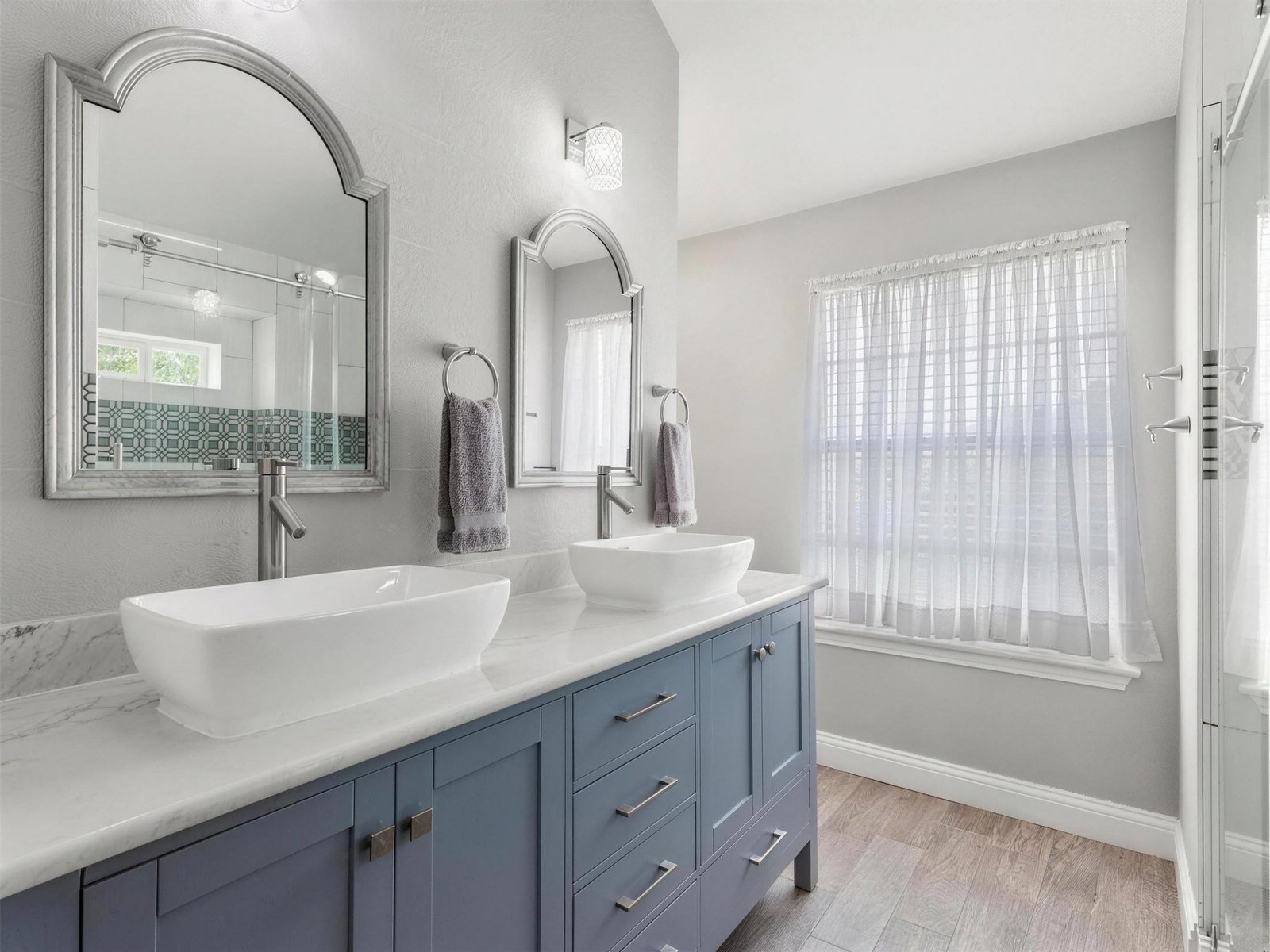 Bathroom remodel in Rowlett, TX — blue vanity vessel sinks — UHS Remodeling project