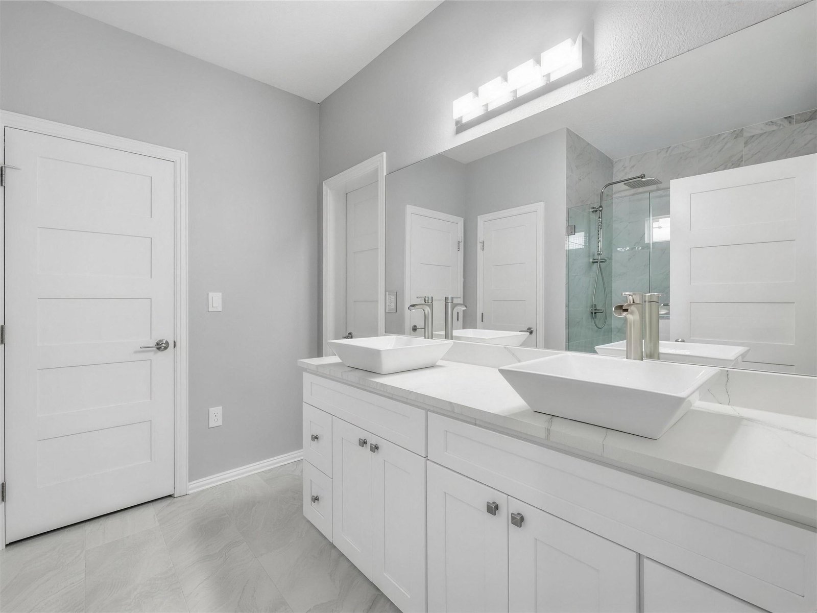 Bathroom remodel in Farmers Branch, TX — double vessel sink vanity — UHS Remodeling project