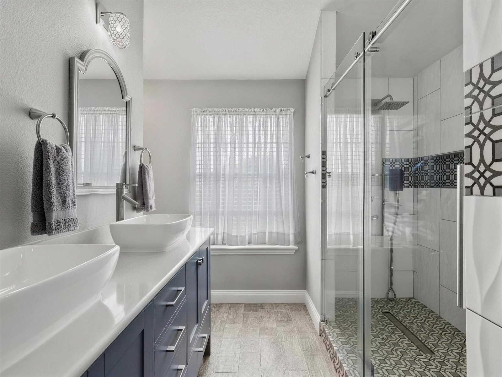 Bathroom remodel in Rowlett, TX — frameless glass shower — UHS Remodeling project