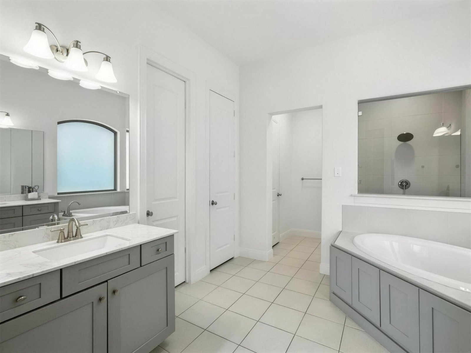 Bathroom remodel in Little Elm, TX — garden tub gray vanity — UHS Remodeling project