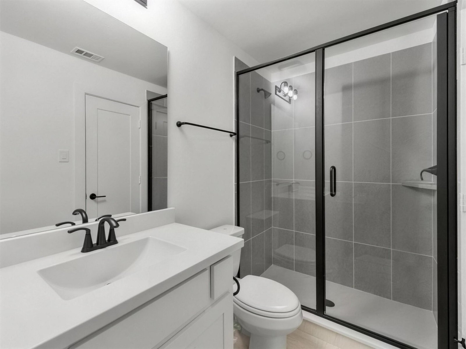 Bathroom remodel in Allen, TX — gray tile glass shower — UHS Remodeling project