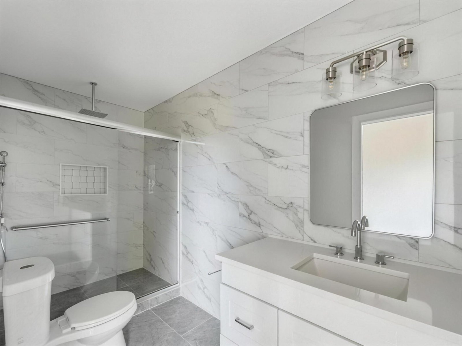 Bathroom remodel in Richardson, TX — marble glass slider shower — UHS Remodeling project