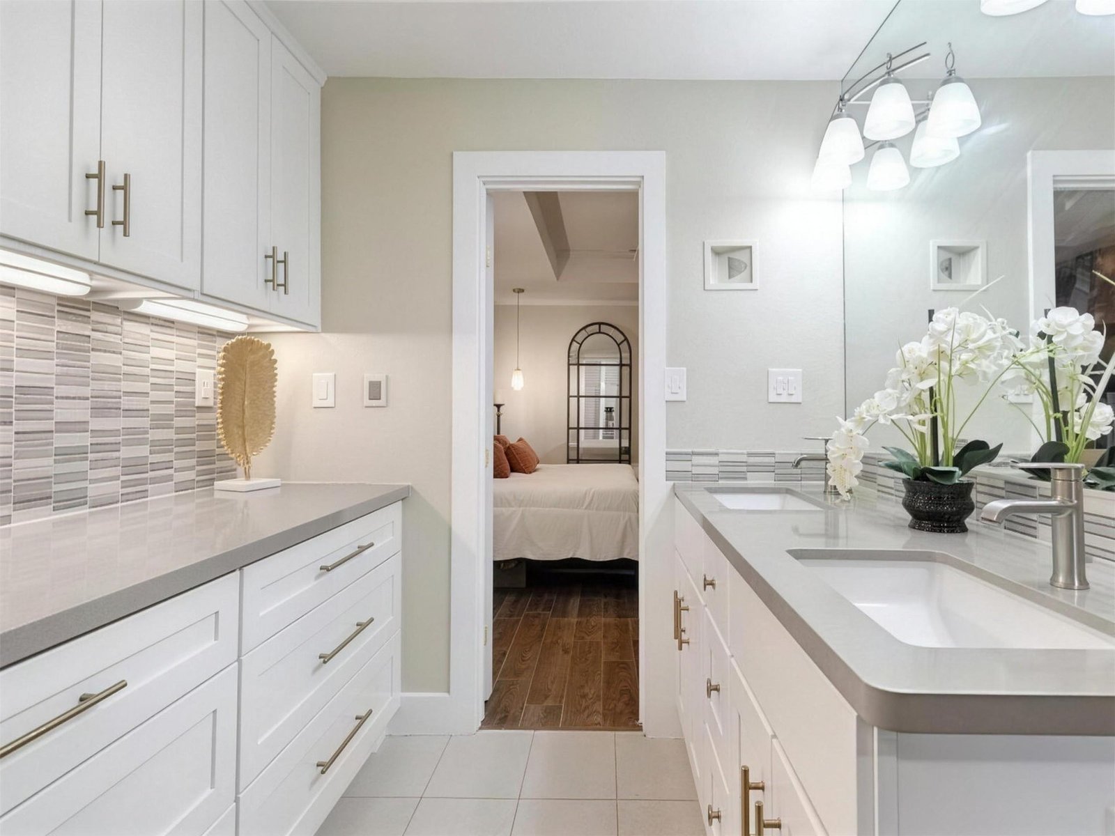 Bathroom remodel in Carrollton, TX — mosaic backsplash gold hardware — UHS Remodeling project