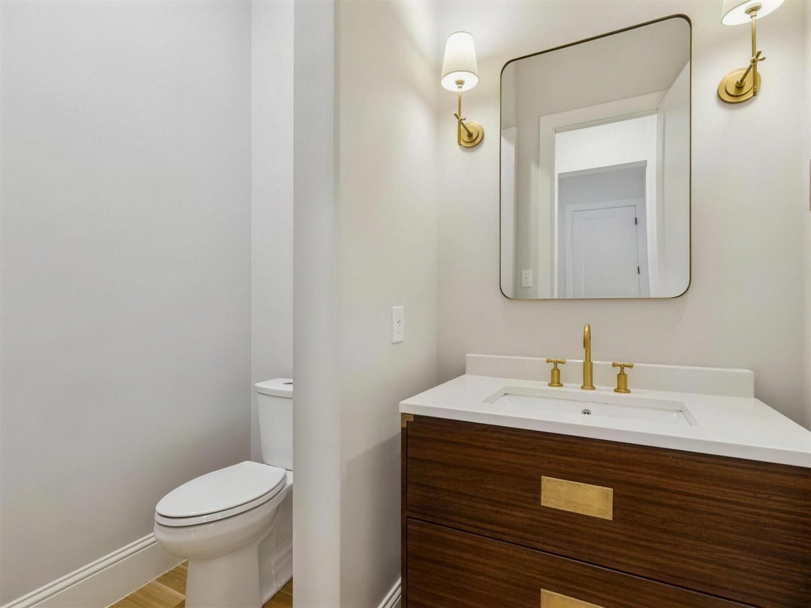 Bathroom remodel in University Park, TX — walnut vanity brass fixtures — UHS Remodeling project