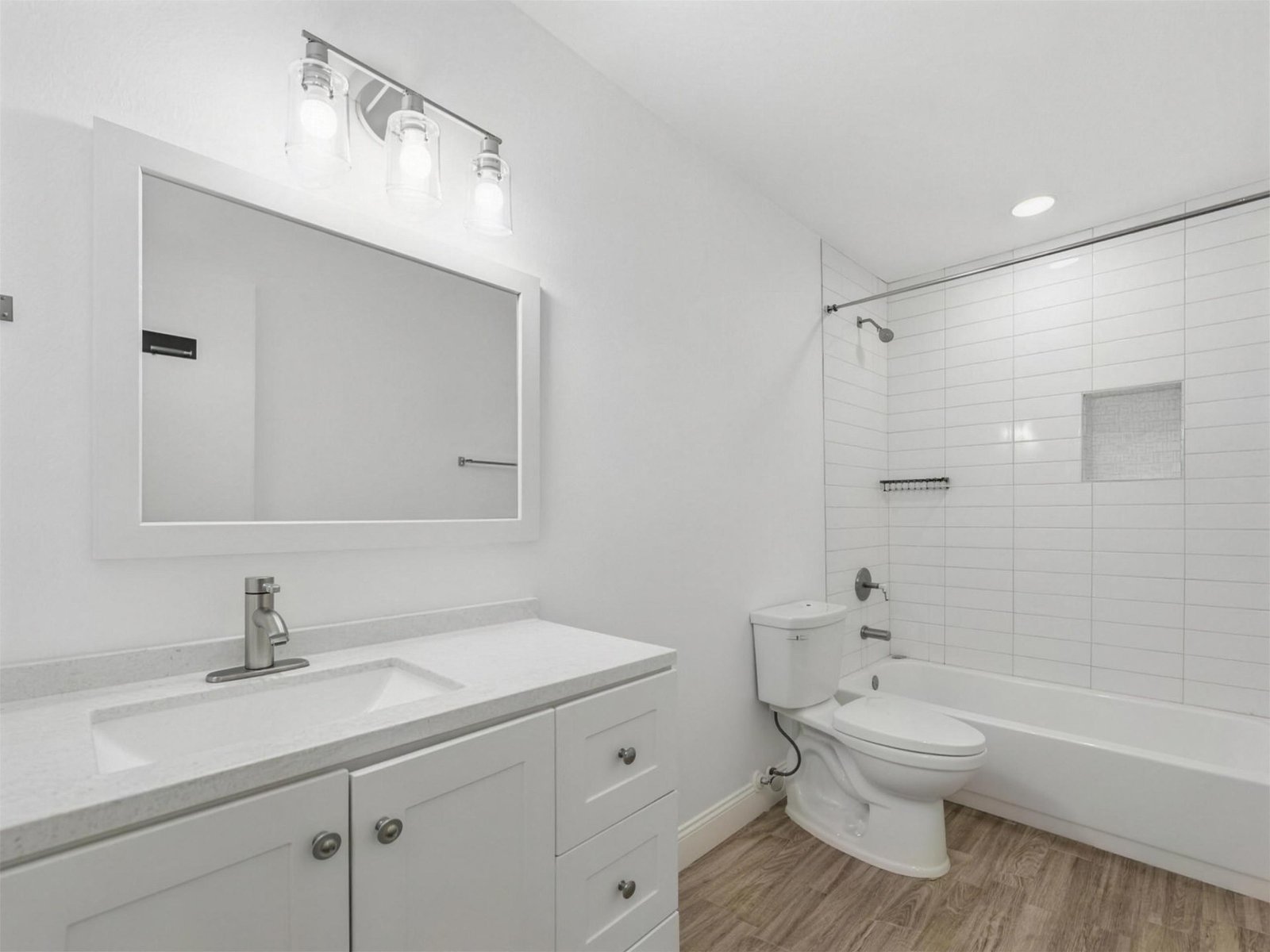 Bathroom remodel in Garland, TX — white subway tile tub — UHS Remodeling project