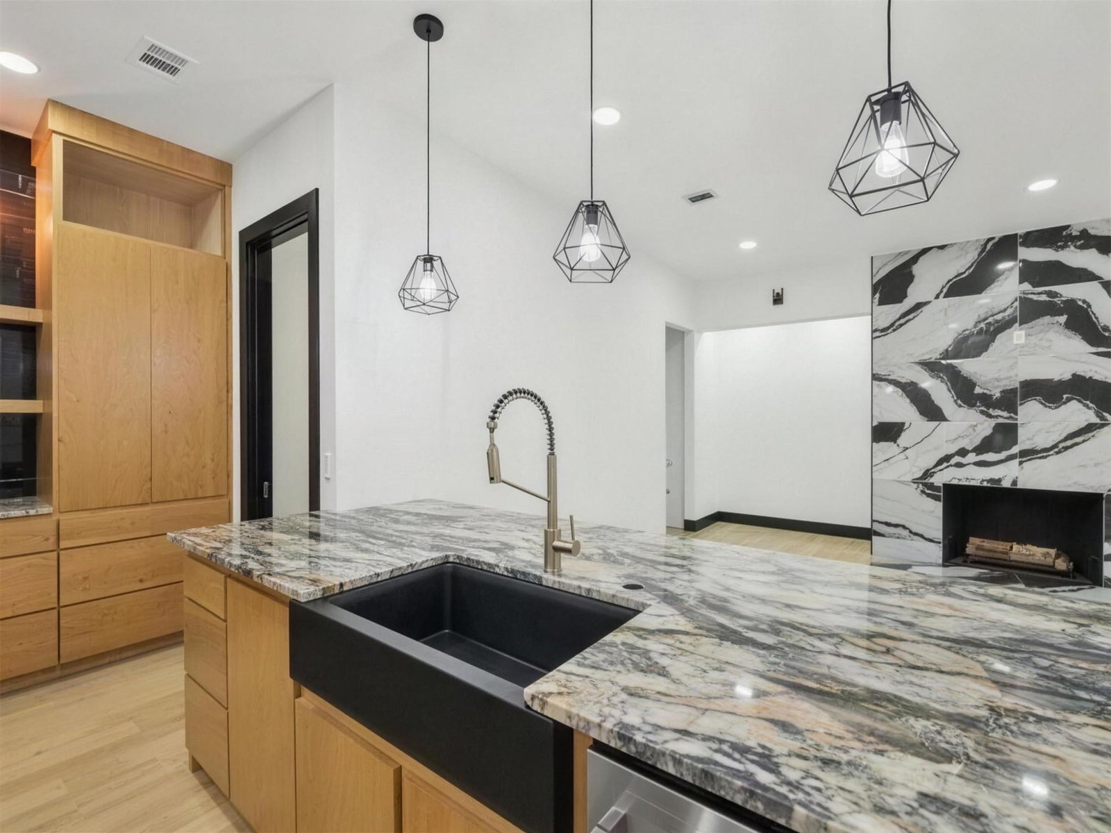 Kitchen remodel in Plano, TX — black farmhouse sink brass faucet — UHS Remodeling project