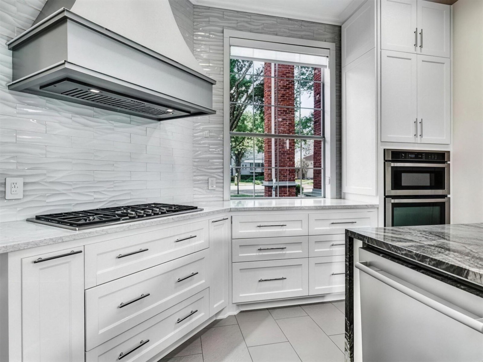 Kitchen remodel in Murphy, TX — gas cooktop gray mosaic backsplash — UHS Remodeling project