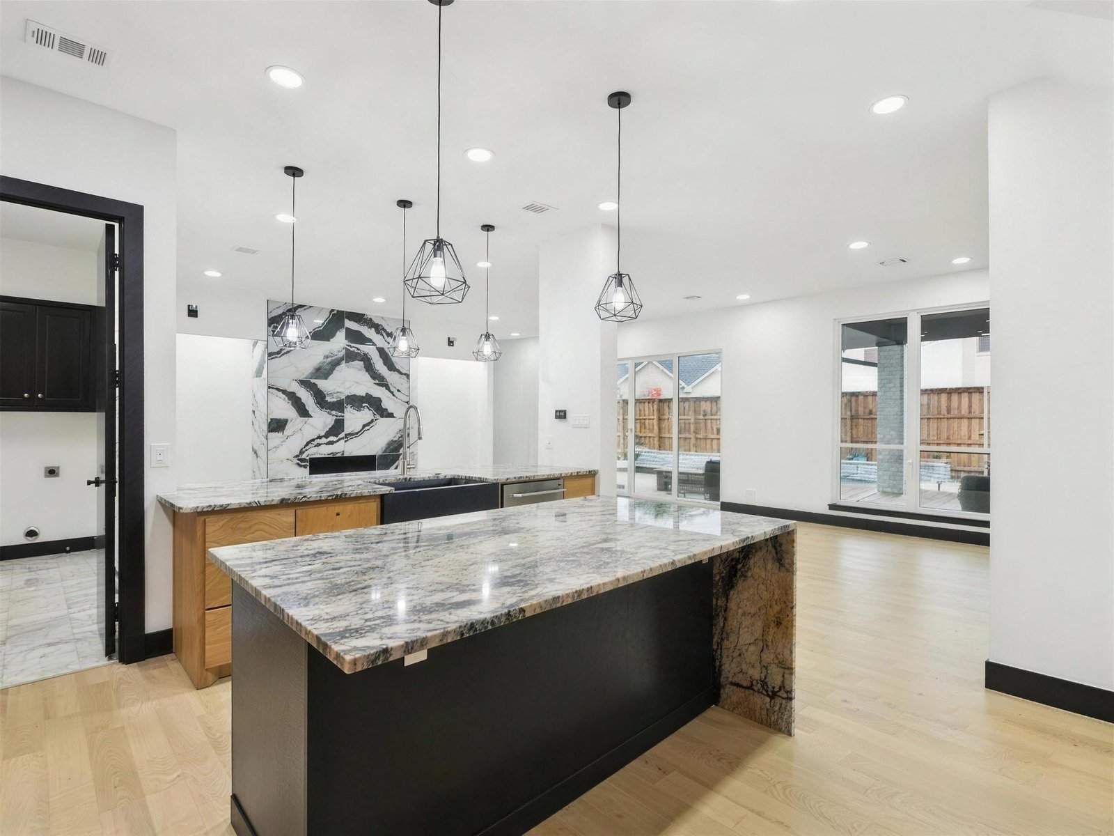 Kitchen remodel in Plano, TX — open concept granite island — UHS Remodeling project