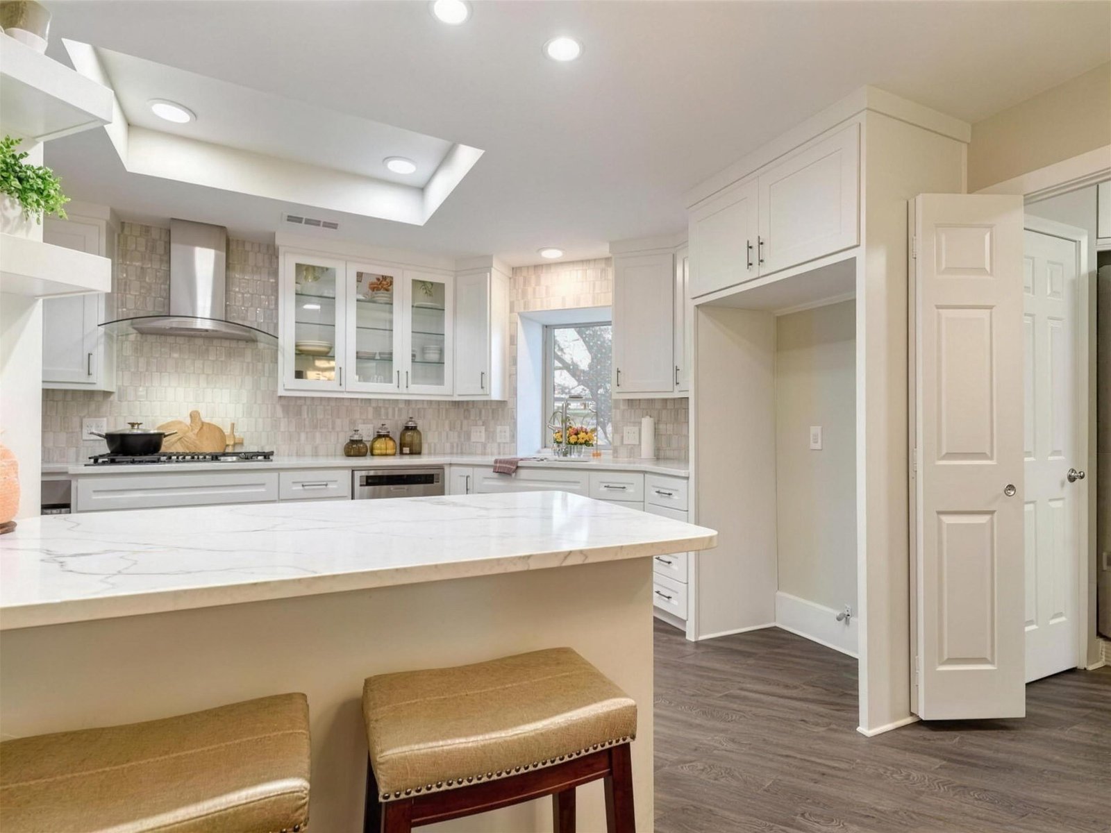 Kitchen remodel in Carrollton, TX — quartz peninsula bar seating — UHS Remodeling project