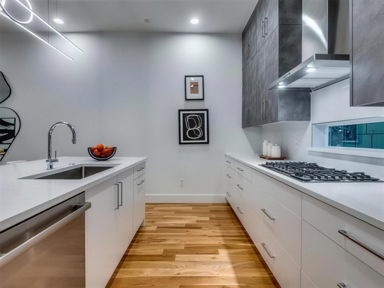 Kitchen remodel in Addison, TX — white galley gas cooktop — UHS Remodeling project