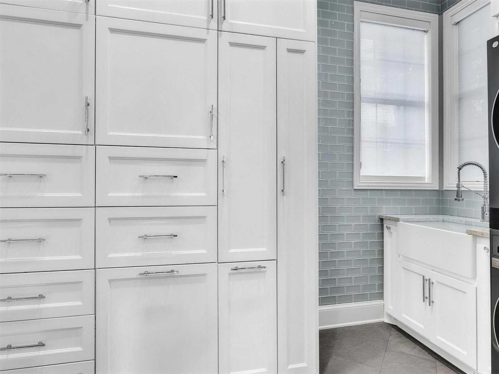 Laundry room remodel in Murphy, TX — farmhouse sink blue subway tile — UHS Remodeling project