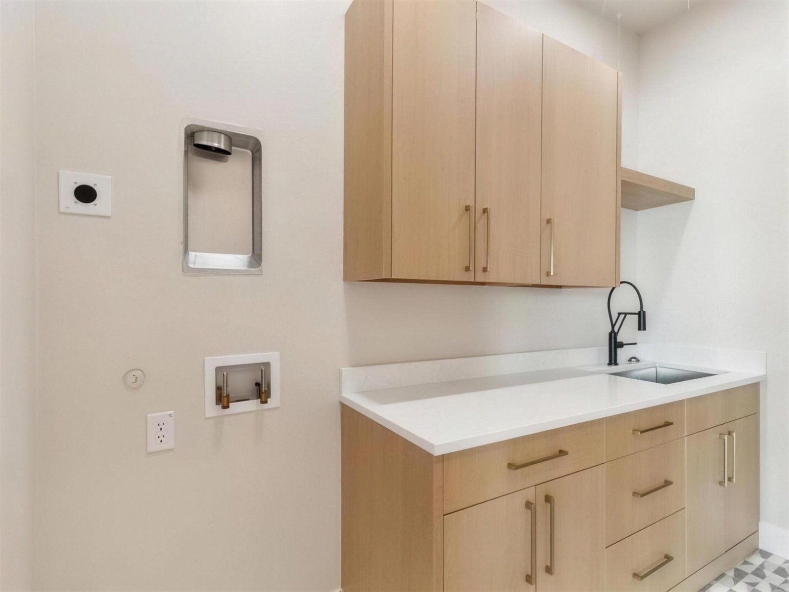 Laundry room remodel in The Colony, TX — light wood laundry cabinets — UHS Remodeling project