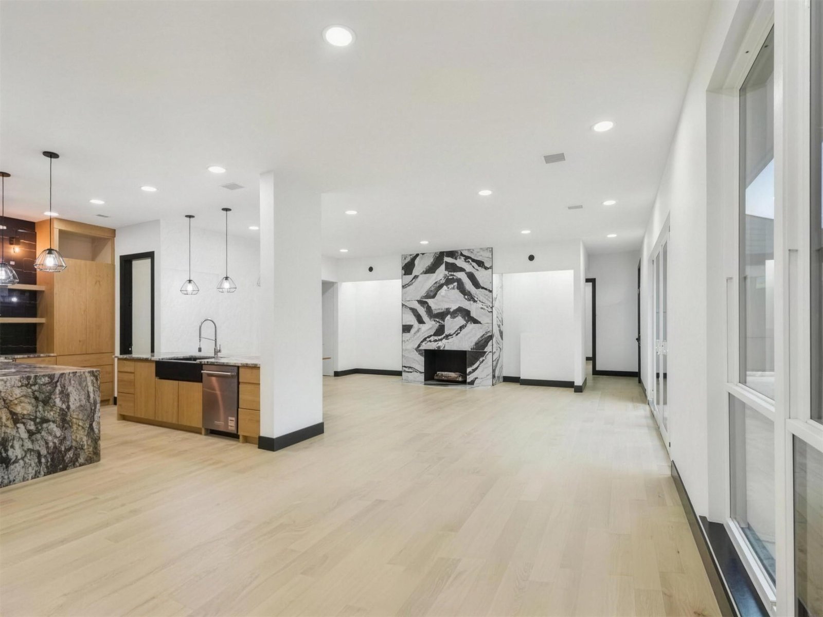 Living room remodel in Plano, TX — marble fireplace accent wall — UHS Remodeling project