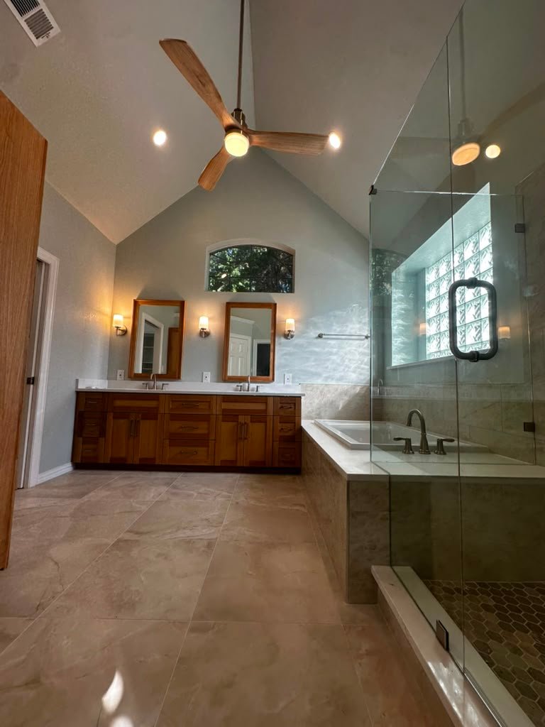 Wide view of a completed master bathroom remodel in Plano, Texas by UHS Remodeling